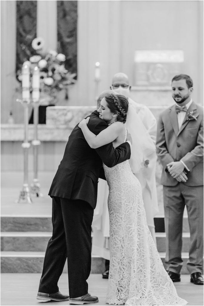 Photo of father giving bride away